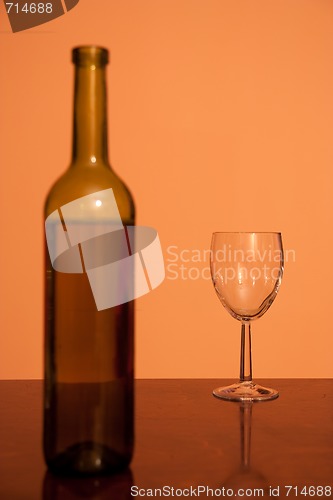Image of bottle with empty glass