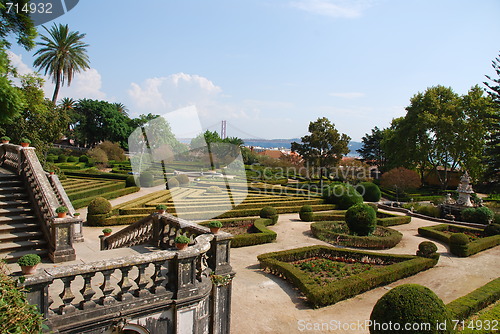 Image of Enchanted Ajuda garden with April 25th bridge in Lisbon, Portugal