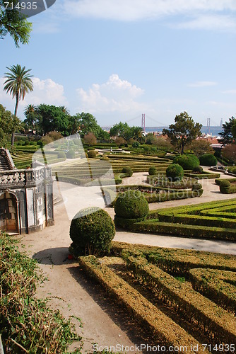 Image of Enchanted Ajuda garden with April 25th bridge in Lisbon, Portugal