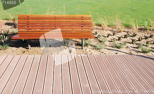 Image of Wooden park bench at the park