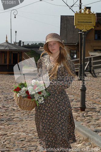 Image of Girl with basket of flowers