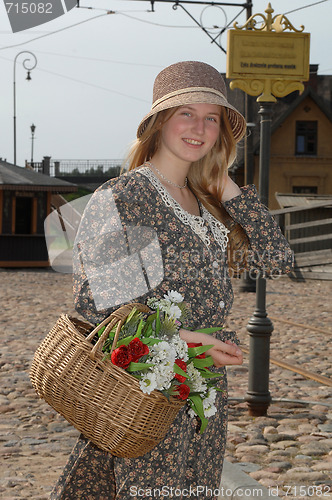 Image of Girl with basket of flowers