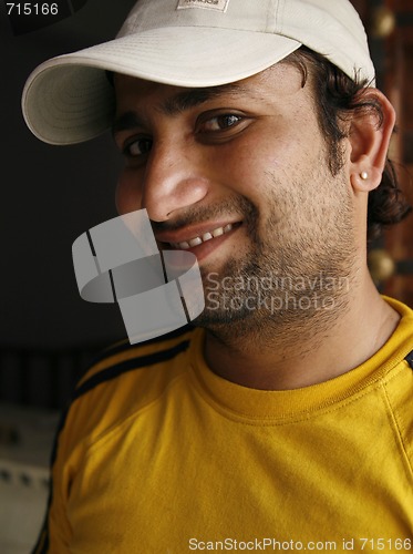 Image of Smiling Indian man in a casual sporty outfit
