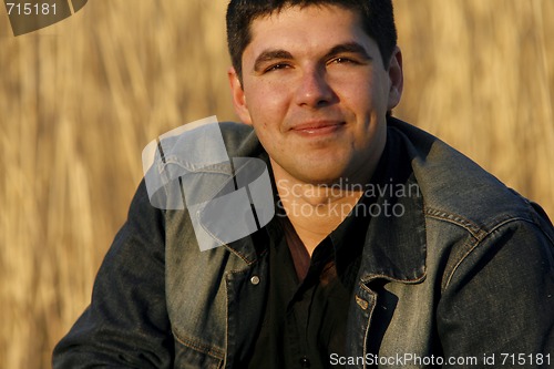 Image of Young handsome man smiling