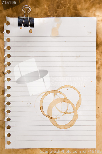 Image of Paper with coffee stains and clip