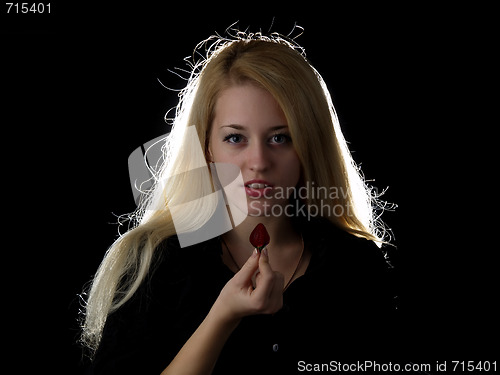 Image of Girl eating strawberry