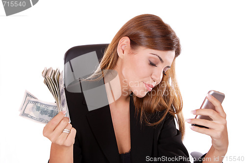 Image of young woman holding money in the hand