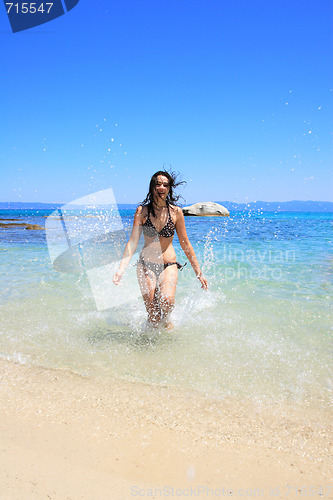 Image of tanned woman in bikini in the sea