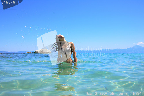 Image of tanned woman in bikini in the sea