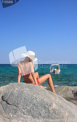 Image of tanned woman in bikini in the sea