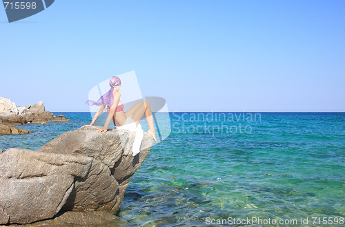 Image of tanned woman in bikini in the sea