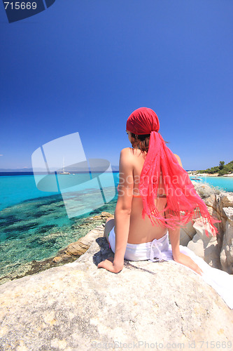 Image of tanned woman in bikini in the sea