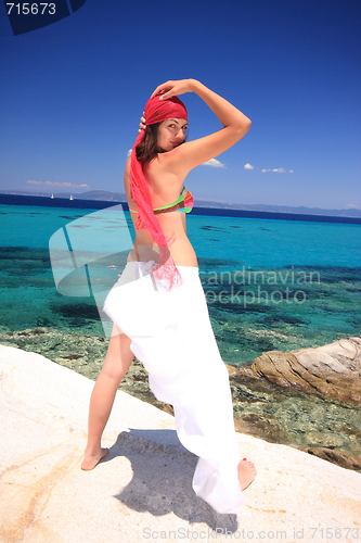 Image of tanned woman in bikini in the sea