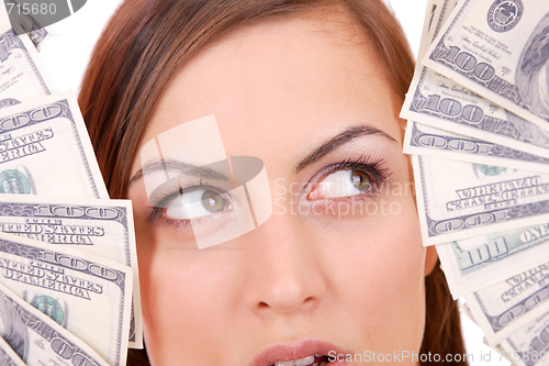 Image of Attractive woman takes lot of 100 dollar bills