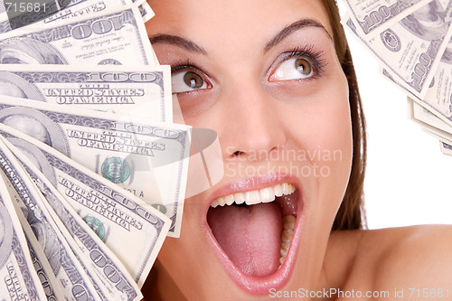 Image of Attractive woman takes lot of 100 dollar bills