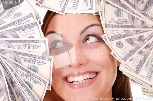 Image of Attractive woman takes lot of 100 dollar bills