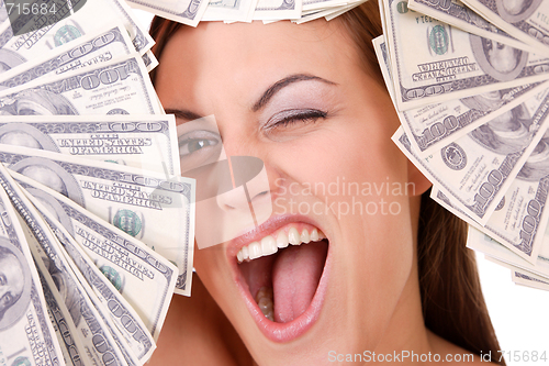 Image of Attractive woman takes lot of 100 dollar bills