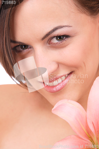 Image of Beautiful woman with flower isolated on white