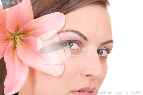 Image of Beautiful woman with flower isolated on white