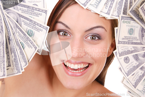 Image of Attractive woman takes lot of 100 dollar bills