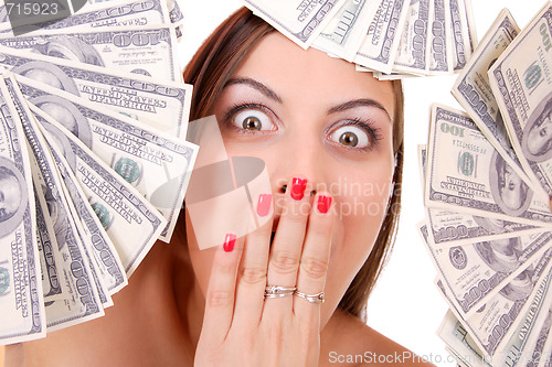 Image of Attractive woman takes lot of 100 dollar bills