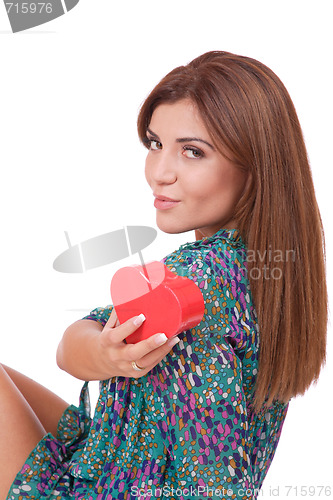 Image of winter portrait of a beautiful young smiling woman