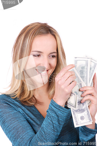 Image of young woman holding money in the hand