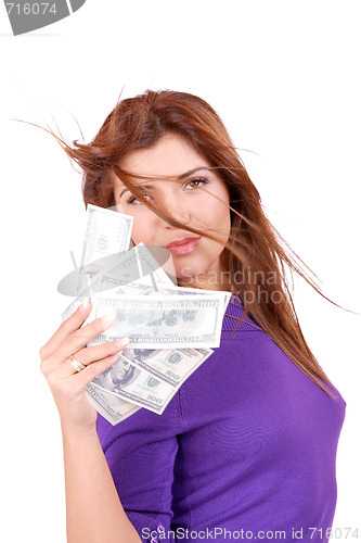 Image of young woman holding money in the hand