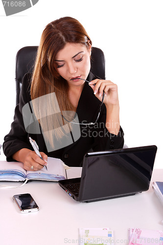 Image of young woman holding money in the hand