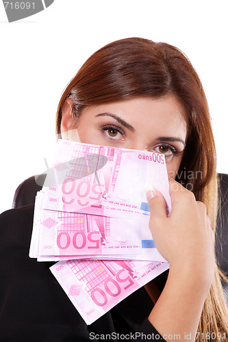 Image of young woman holding money in the hand