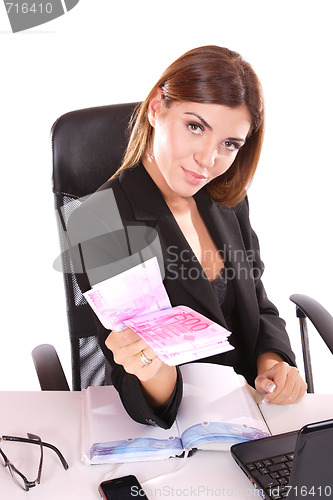 Image of young woman holding money in the hand