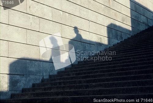 Image of shadows of the people in the stairs