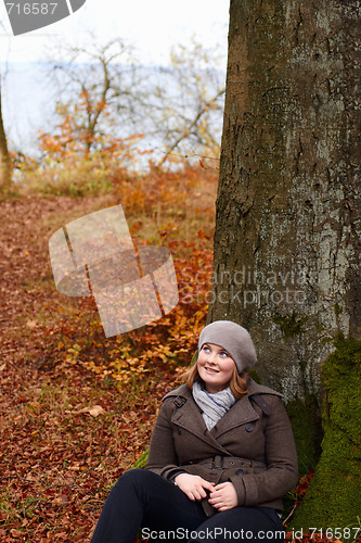 Image of Fall - Cute young woman looking up at copyspace