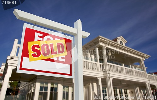 Image of Sold Home For Sale Sign in Front of New House 