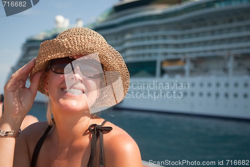 Image of Beautiful Vacationing Woman with Cruise Ship