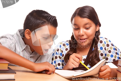 Image of Hispanic Brother and Sister Having Fun Studying