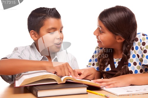 Image of Hispanic Brother and Sister Having Fun Studying
