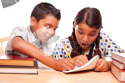 Image of Hispanic Brother and Sister Having Fun Studying