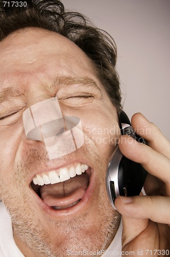 Image of Ecstatically Happy Man on Cell Phone