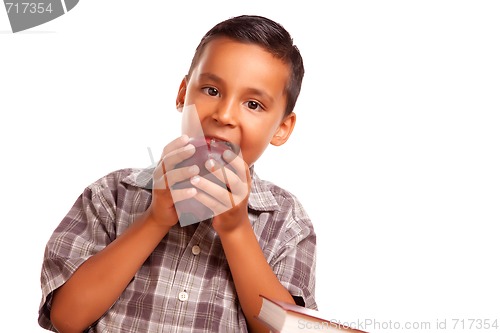 Image of Adorable Hispanic Boy Eating a Large Red Apple
