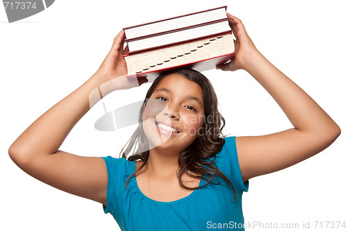 Image of Pretty Hispanic Girl with Books on Her Head