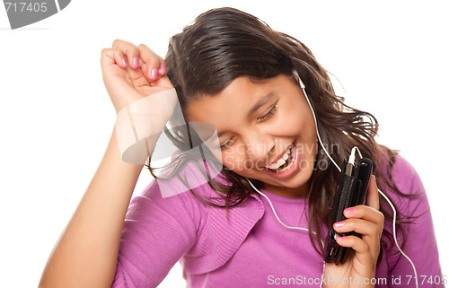 Image of Pretty Hispanic Girl Listening and Dancing to Music