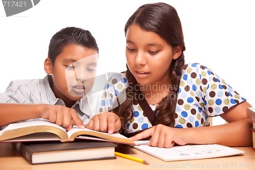 Image of Hispanic Brother and Sister Having Fun Studying