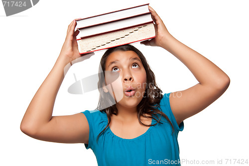 Image of Pretty Hispanic Girl with Books on Her Head