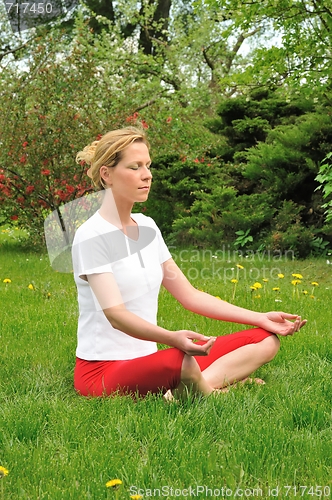 Image of Young woman doing yoga - meditation