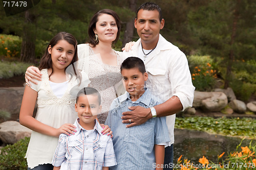 Image of Happy Hispanic Family In the Park