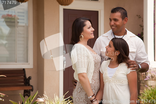 Image of Small Hispanic Family in Front of Their Home