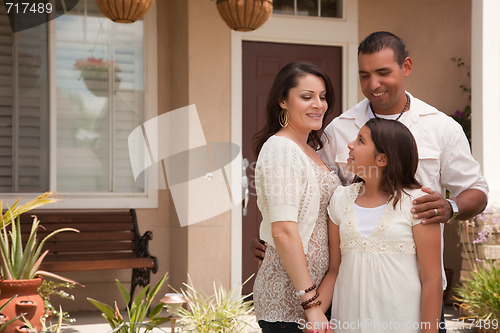 Image of Small Hispanic Family in Front of Their Home