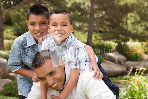 Image of Father and Sons in the Park