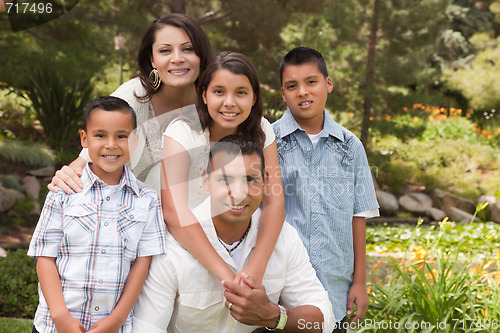 Image of Happy Hispanic Family In the Park